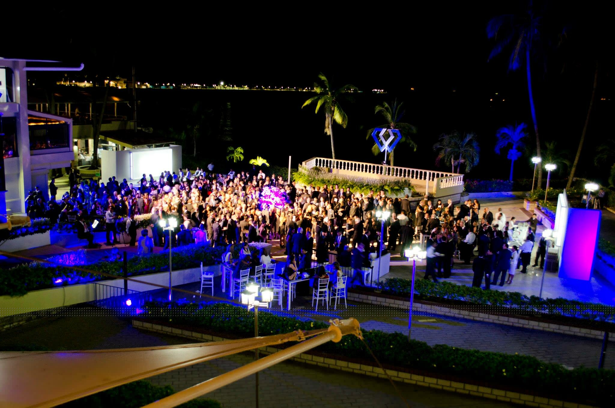 Attendees at the PDE Gala Dinner on March on the terrace at Panama City's Union Club, overlooking the Pacific Ocean.